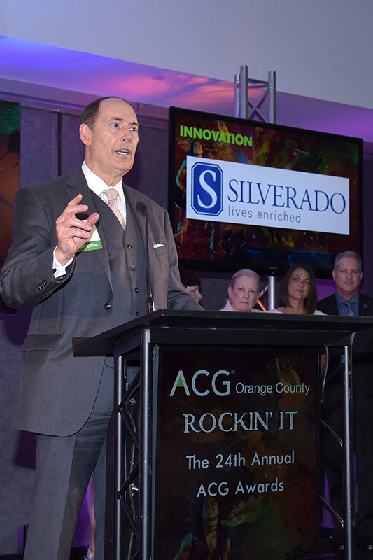 Loren speaking at ACG conference.